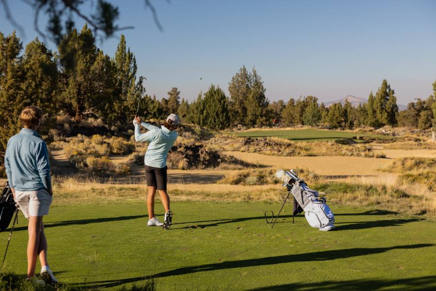Two men golfing in spring in oregon