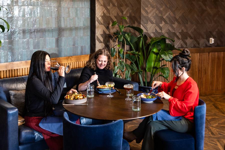 Three women having dinner on-site at juniper Preserve