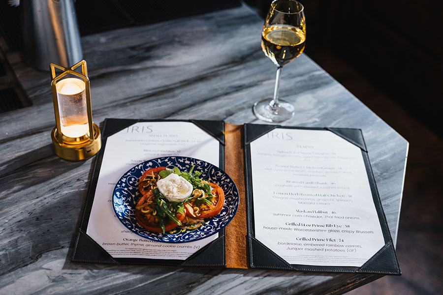 Caprese salad, white wine and a menu